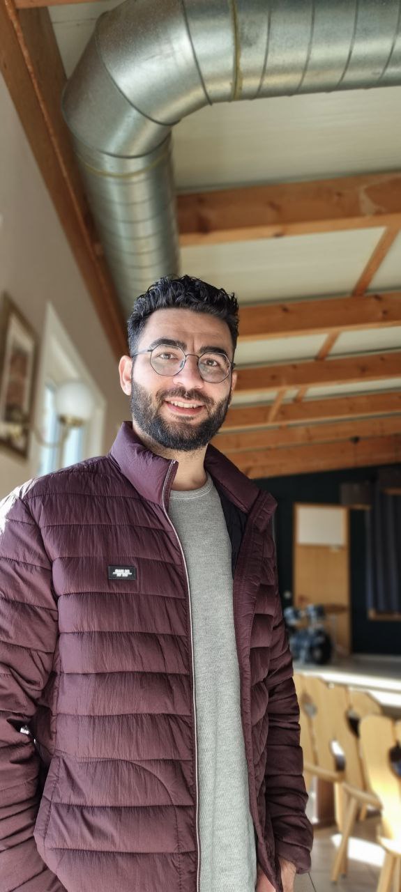 A pensive shot of Alex looking sideways.